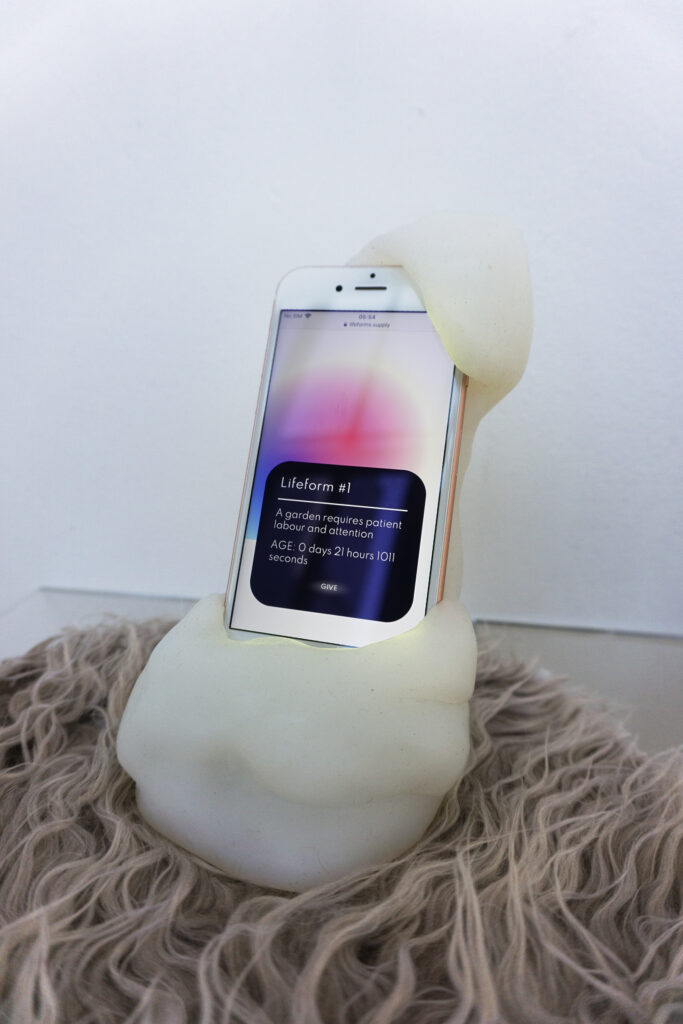 Sarah Friend, Lifeform Display Surface #1 (first generation), 2021, silicone, iphone, custom webapp, and NFT, 18 x 12 x 10cm, from Lifeforms, Photo: Sarah Friend, Courtesy: Nagel Draxler